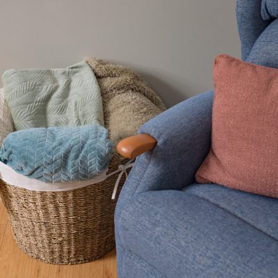 Rise recline armchair and basket of comforting throws